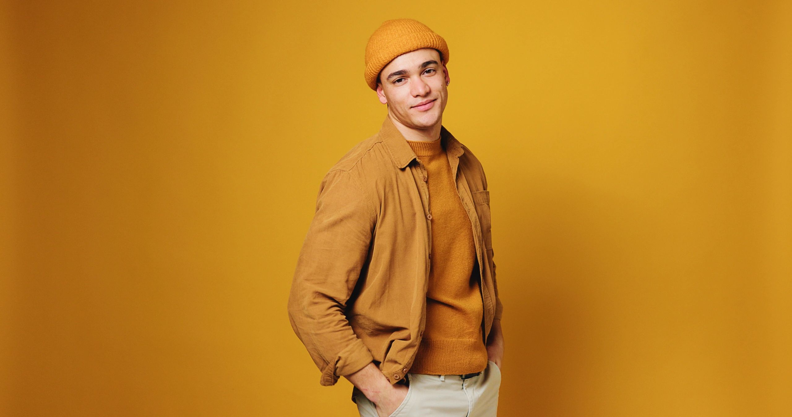 Fashion model wearing a winter cap in a studio