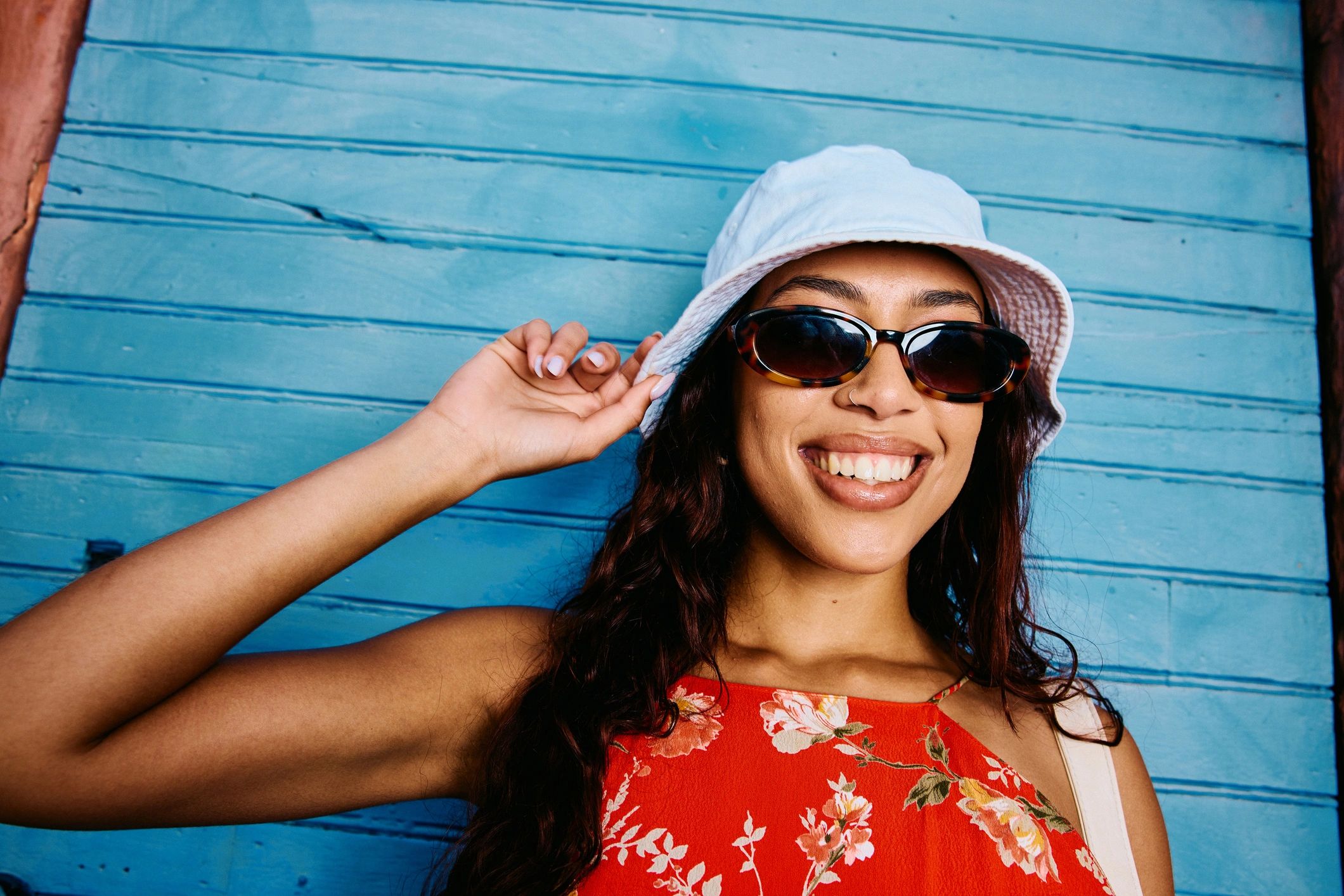 Smiling woman wearing a stylish summer hat